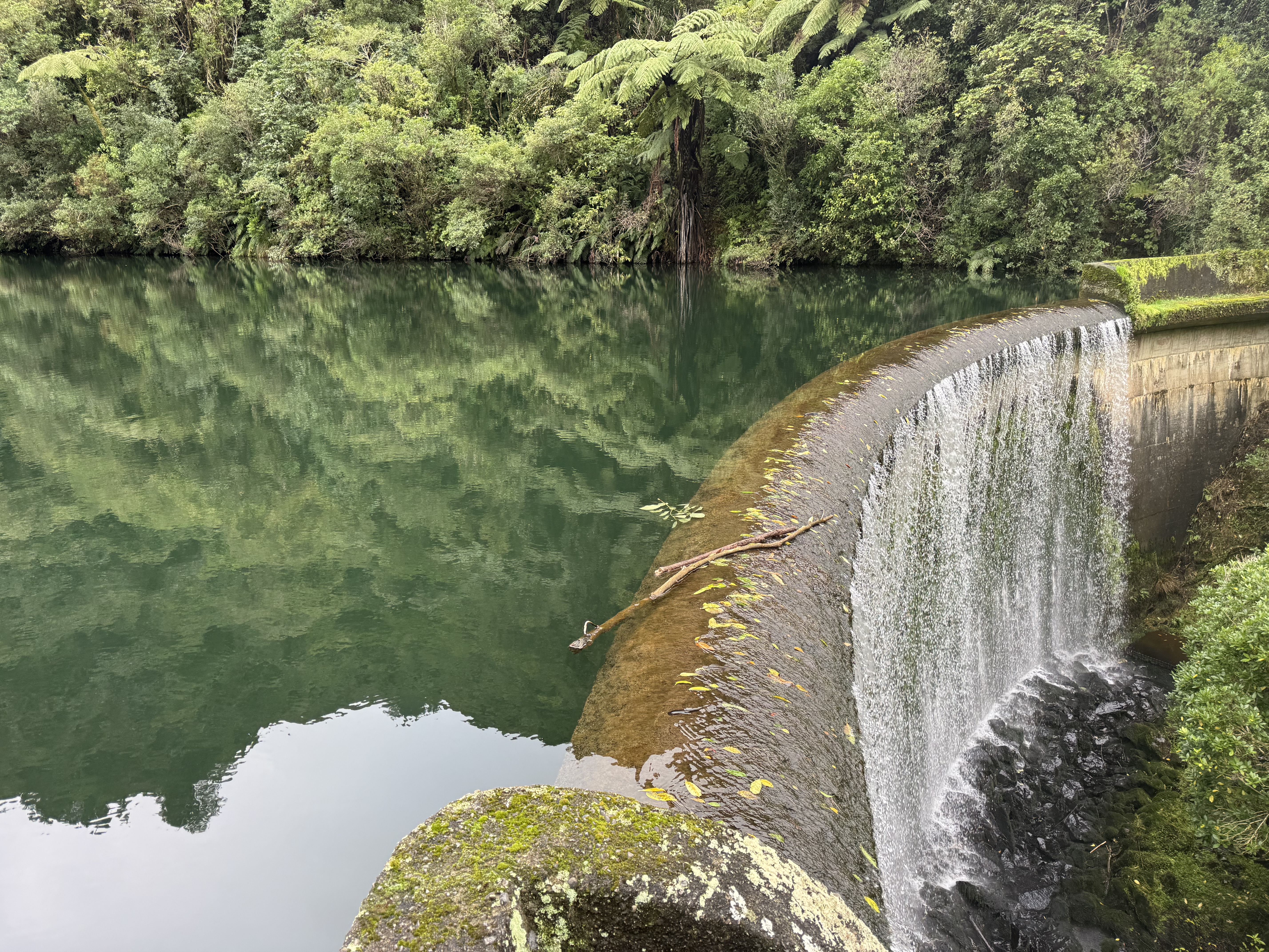 A peaceful New Zealand waterfall and lake